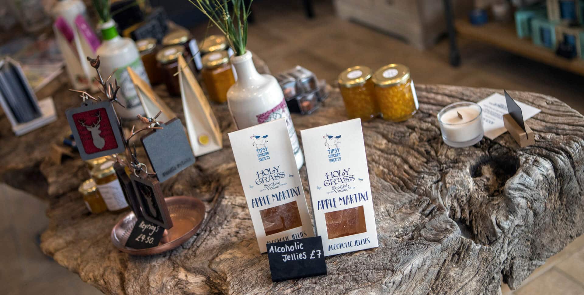 Dunnet Bay Distillery selection of products in shop on a wooden table